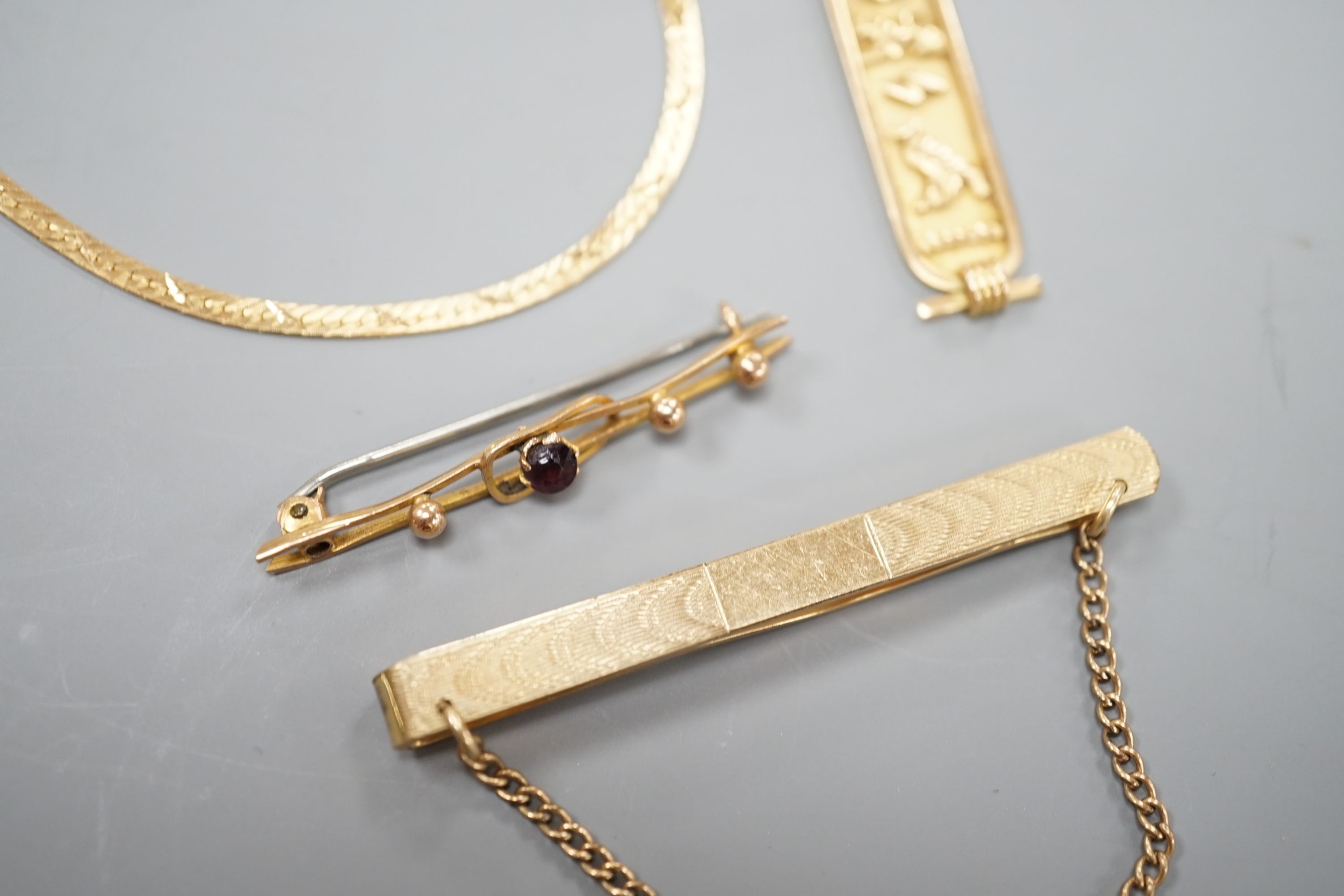 A Middle Eastern pendant and bracelet, gross 6.5 grams, together with a 9ct bar brooch and a rolled gold tie clip.